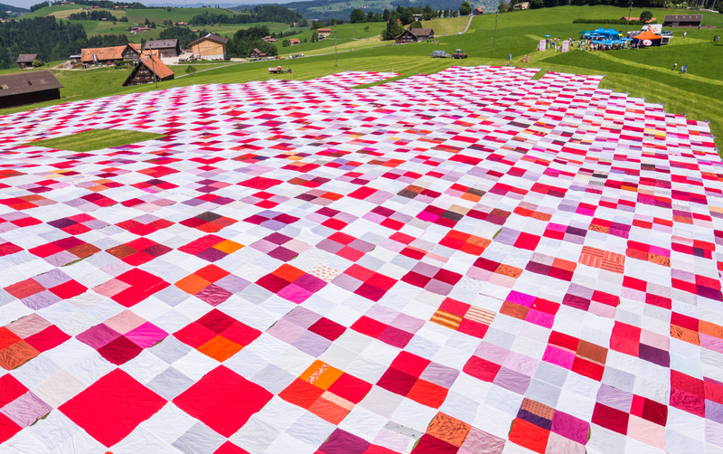 Illustration for article titled The World's Biggest Picnic Blanket Is Growing in the Swiss Countryside